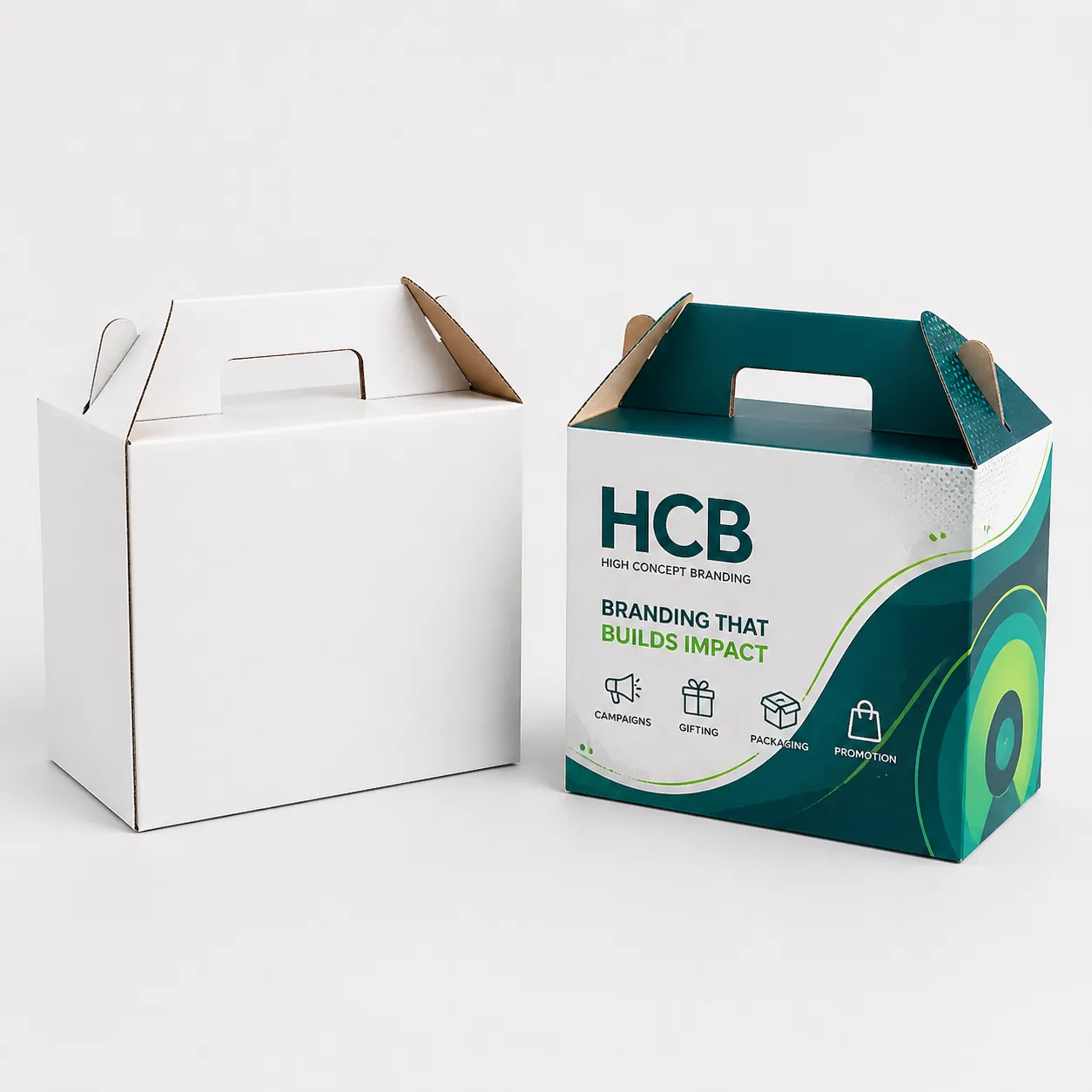 White and teal cardboard gable boxes with integrated carry handles. class=